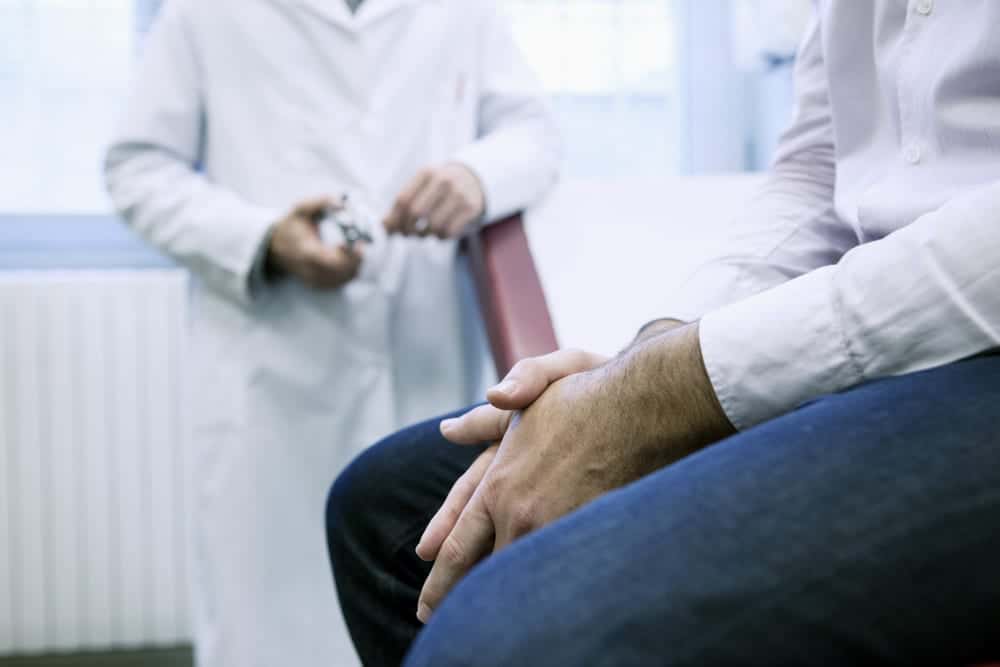 man sitting in doctors office