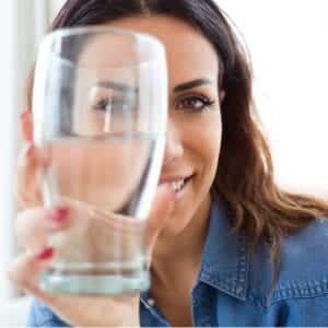 woman holding glass up