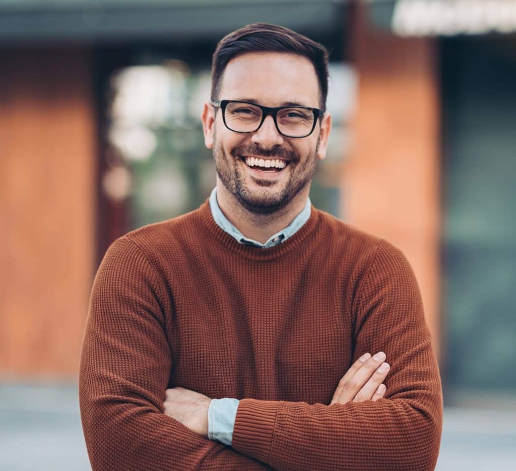 Smiling man outdoors in the city