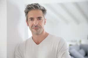 An older man experiencing low testosterone symptoms