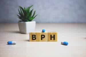 Wooden blocks that spell out "BPH"